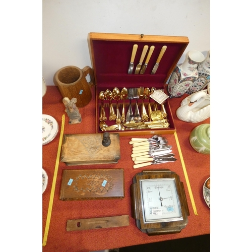 3193 - A boxed set of gold plated cutlery, small wooden boxes, a wooden tankered, and anaroid barometer and... 