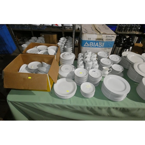 1186 - A large quantity of white crockery by China Craft inc 40 cups and saucers, extra saucers, plates etc