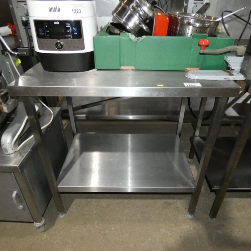 1224 - A commercial stainless steel catering type table with shelf beneath and industrial tin opener approx... 