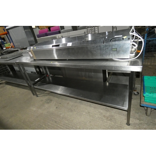 1254 - A commercial stainless steel catering type table with shelf beneath approx 200x65cm