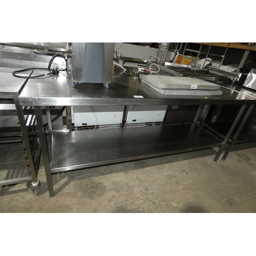 1257 - A commercial stainless steel catering type table with shelf beneath approx 200x66cm