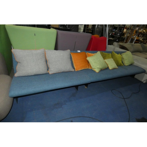 1431 - A blue upholstered two part reception type sofa with various scatter cushions approx 300cm wide (120... 