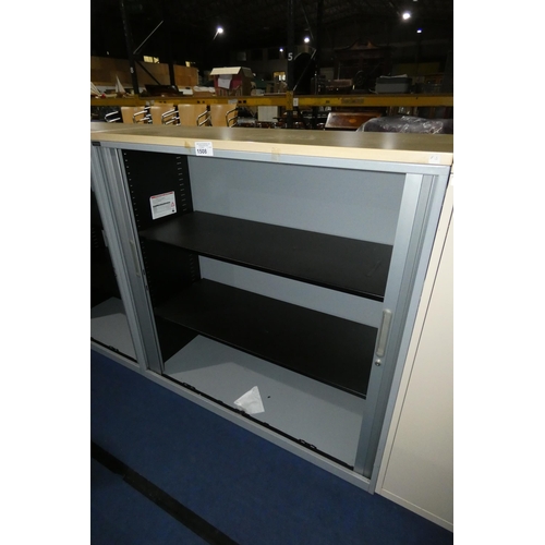 1508 - 1 x Triumph grey metal tambour door cabinet with wood effect top approx 120 x 47 x 121cm high