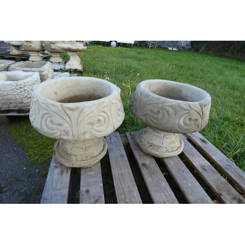 1316 - A pair of goblet style concrete urn planters