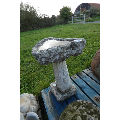 1329 - A tall concrete weathered triangular bird bath