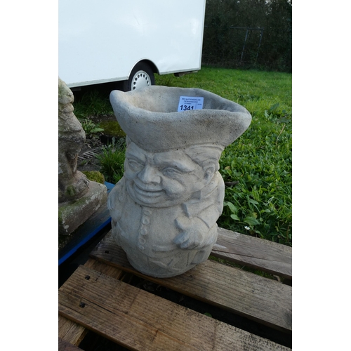 1341 - A concrete Toby jug style concrete planter