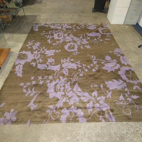 1569 - A large brown / purple patterned rug by The Rug Company approx 275cm x 360cm