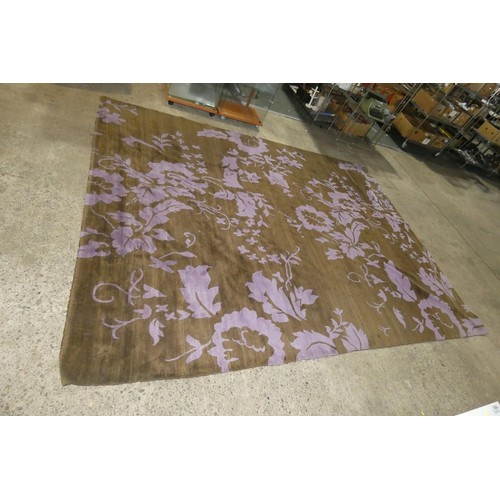 1570 - A large brown / purple patterned rug by The Rug Company approx 275cm x 360cm