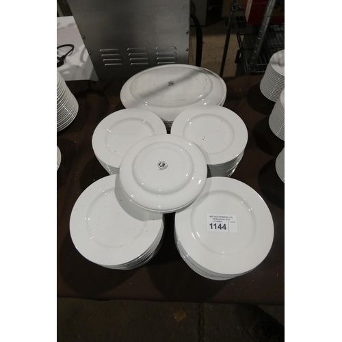 1144 - A large quantity of various white crockery including over 80 20cm plates by Churchill