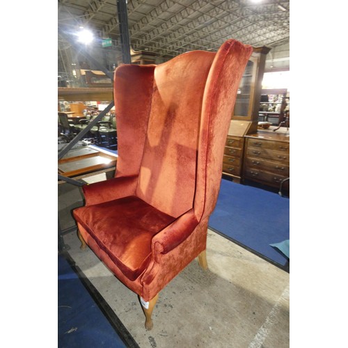 1594 - A vintage Howard and Sons style wingback high back armchair upholstered in burnt orange velour fabri... 