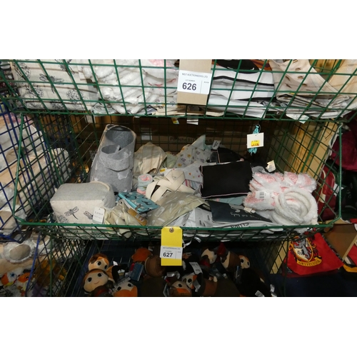 627 - A quantity of various gift related items including bags, a fabric door stop, rabbit ears etc, conten... 