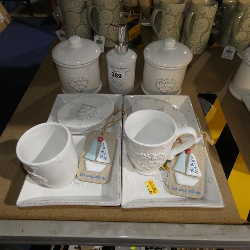 389 - A decorative bathroom set, jars, soap dishes etc