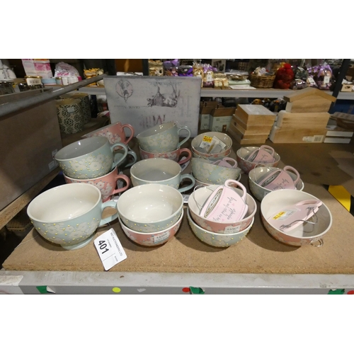 401 - A quantity of baby blue and pink patterned teacups and sugar bowls etc