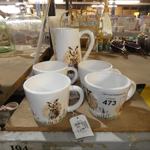 473 - A water jug and 4 mugs with a sheep design