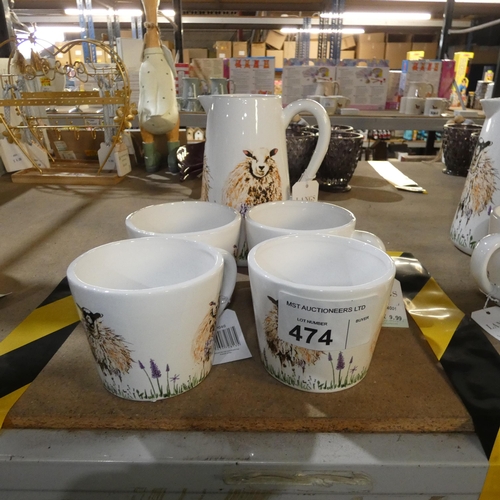 474 - A water jug and 4 mugs with a sheep design