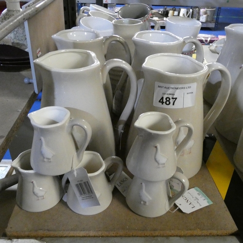 487 - 4 x large water jugs and 5 x small milk jugs with geese