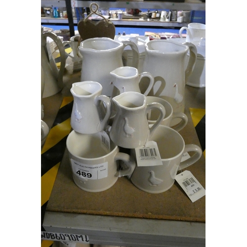 489 - 2 x large water jugs, 4 mugs & 3 x small milk jugs with geese