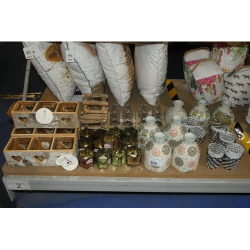 502 - A quantity of various gift related items including candle holders, jugs, bottles etc