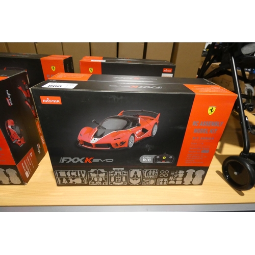 860 - 2 x Rastar radio controlled cars - Ferrari FXXK EVO. Boxed and requires assembly