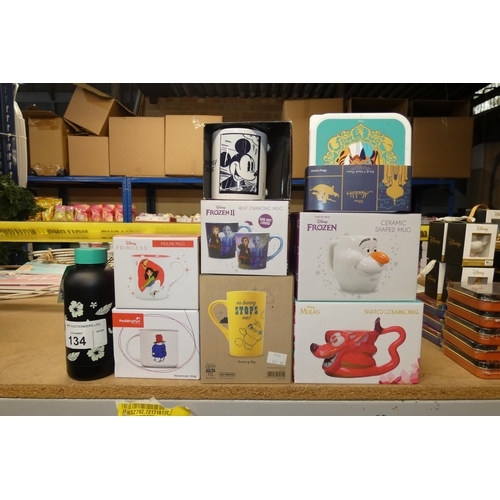 134 - A quantity of various Disney items including ceramic mugs, metal bottles etc