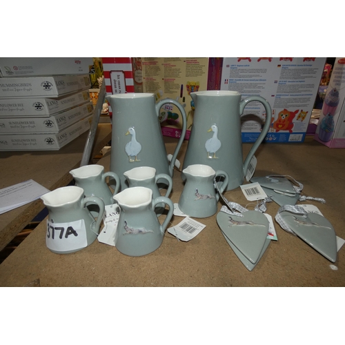 377A - A quantity of various Langs stoneware milk jugs and 5 various hanging hearts