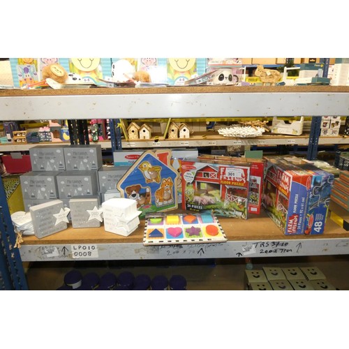 301 - A quantity of various items including floor puzzles, savings boxes etc