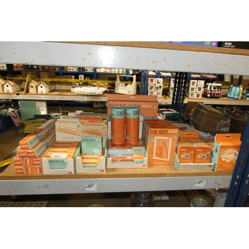 302 - A quantity of various items by Vintage Memories including recorders, harmonicas, glass marbles, pin ... 