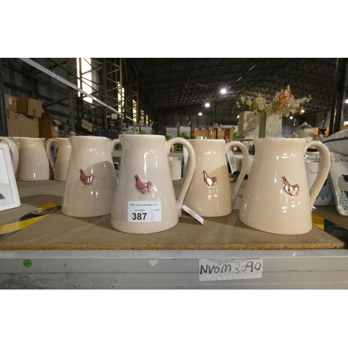 387 - 4 x poultry related water jugs