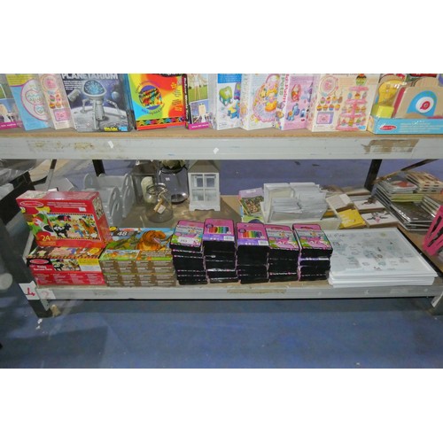 353 - A quantity of various items including floor puzzles, crayons and world maps. Contents of 1 shelf