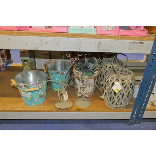 175 - A quantity of various items including colourful metal buckets, card holders, large candle holders et... 