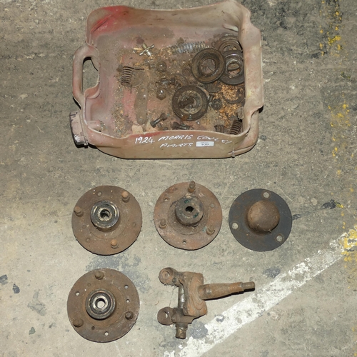 109 - 1 x box containing a quantity of hubs and a stub axle for a 1924 Morris Cowley