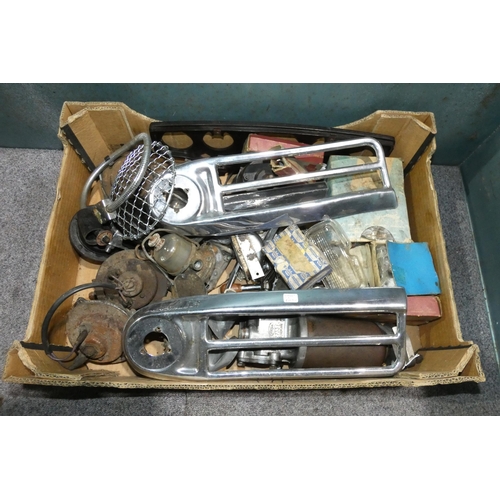 140 - One box containing a quantity of classic car parts to include Wolseley front trims, various horns, e... 