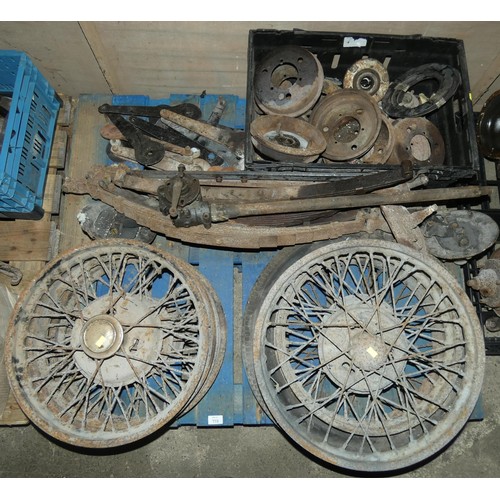 119 - A quantity of various Austin 7 parts to include wheels, springs, a front axle and brake drums etc, c... 