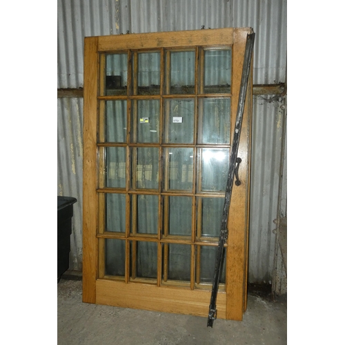 5752 - 2 x Oak sliding interior doors each with 20 x small panes of glass fitted, each approx 120cm wide x ... 