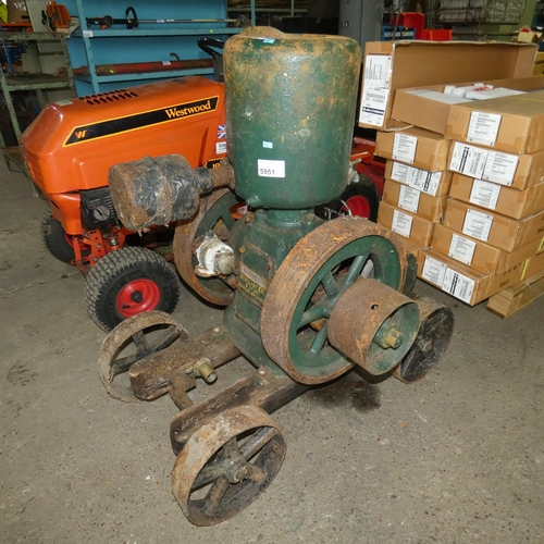 5951 - A vintage water cooled Lister petrol stationary engine no. 204365, 4hp, with starting handle, mounte... 