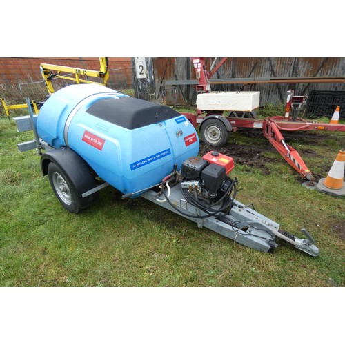 5997 - A blue plastic tow behind water bowser on a braked single axle trailer, capacity approx 1100L, has a... 