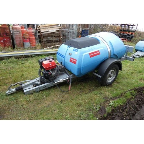 5997 - A blue plastic tow behind water bowser on a braked single axle trailer, capacity approx 1100L, has a... 