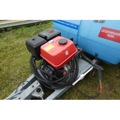 5997 - A blue plastic tow behind water bowser on a braked single axle trailer, capacity approx 1100L, has a... 