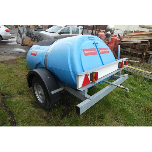 5997 - A blue plastic tow behind water bowser on a braked single axle trailer, capacity approx 1100L, has a... 