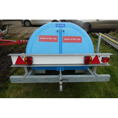 5997 - A blue plastic tow behind water bowser on a braked single axle trailer, capacity approx 1100L, has a... 