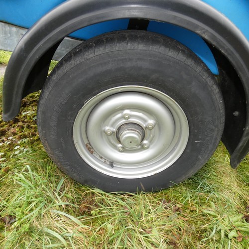 5998 - A blue plastic tow behind water bowser on a braked single axle trailer, capacity approx 1100L