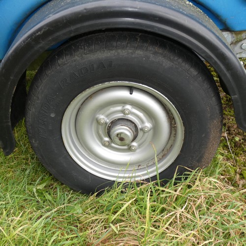 5998 - A blue plastic tow behind water bowser on a braked single axle trailer, capacity approx 1100L