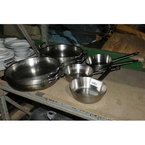 1082 - A quantity of various stainless steel skillets and pans