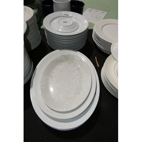 1106 - A quantity of various white crockery including plates by Athena, Churchill serving platters etc