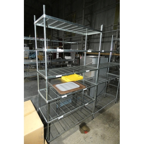 1153 - A tall catering type rack with 6 adjustable shelves approx 120x48x224