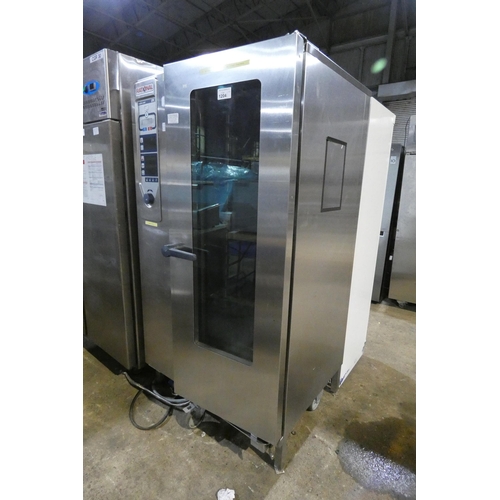 1204 - A commercial stainless steel 20 grid combi oven by Rational type CPC201, comes with filter and troll... 