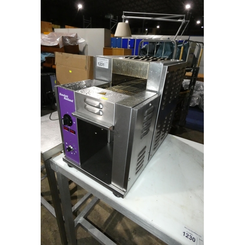 1231 - A commercial stainless steel rotary toaster by Rowlett Rutland. Tested Working