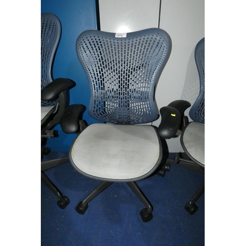 1372 - 1 x Herman Miller Mirra office swivel chair with grey mesh seat and dark blue plastic back