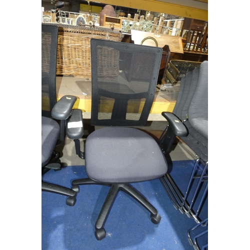 1412 - 1 x Senator black upholstered office swivel chair with black mesh back panel