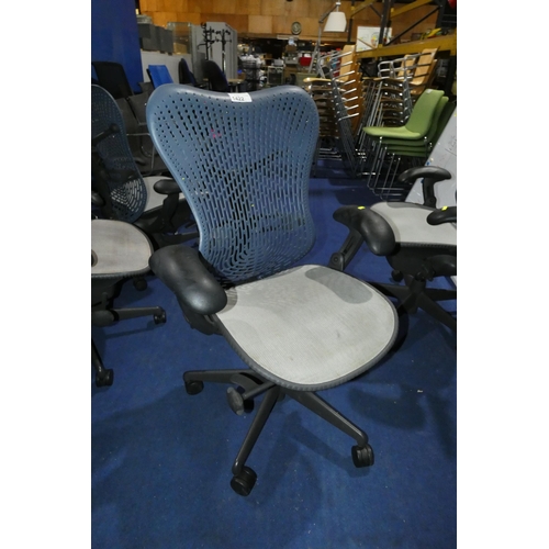 1422 - 1 x Herman Miller Mirra office swivel chair with grey mesh seat and dark blue plastic back